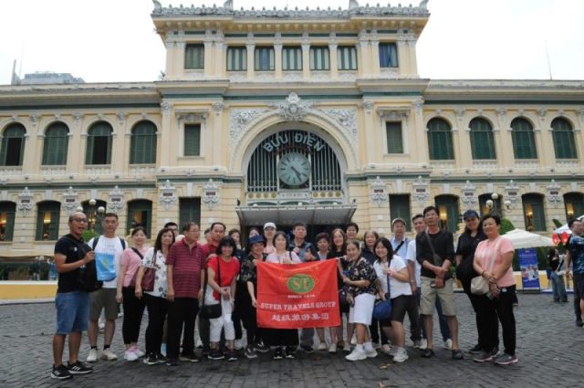 Super Travels tour group at the Central Post Office, Ho Chi Minh City, Vietnam
