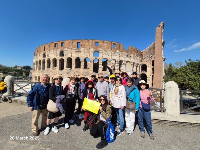 Super Travels tour group at the Colosseum, Rome