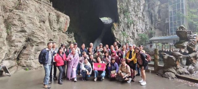 Super Travels tour group at a cave scenic area in China